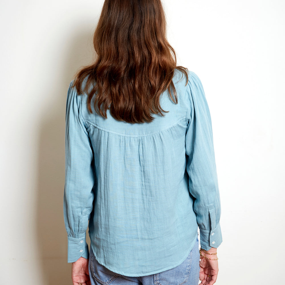 
                      
                        Amelie Blouse In Bleu
                      
                    